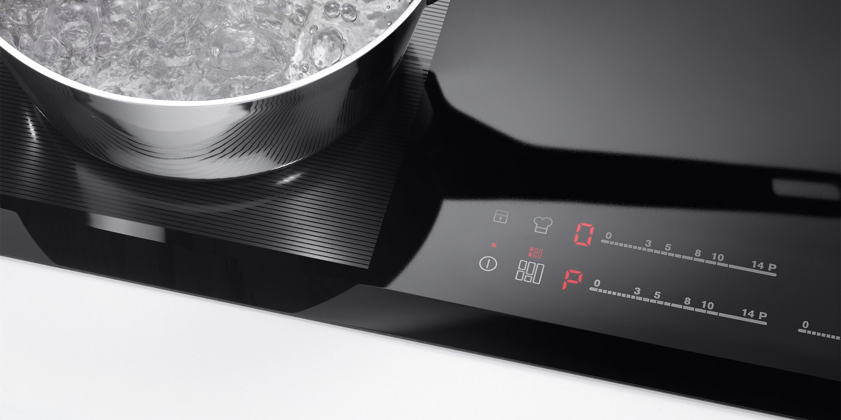 Sustabdymo ir paleidimo mygtukas ant „Electrolux“ indukcinės kaitlentės