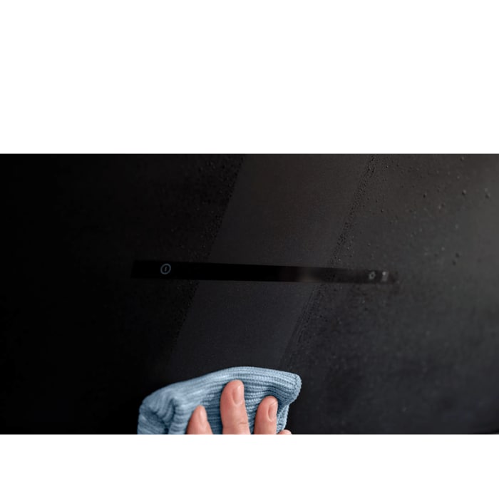 The textural-looking, matt black glass is easy to clean.