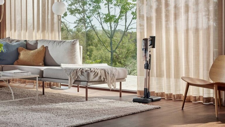 An energy-efficient stick vacuum cleaner from Electrolux in a living room