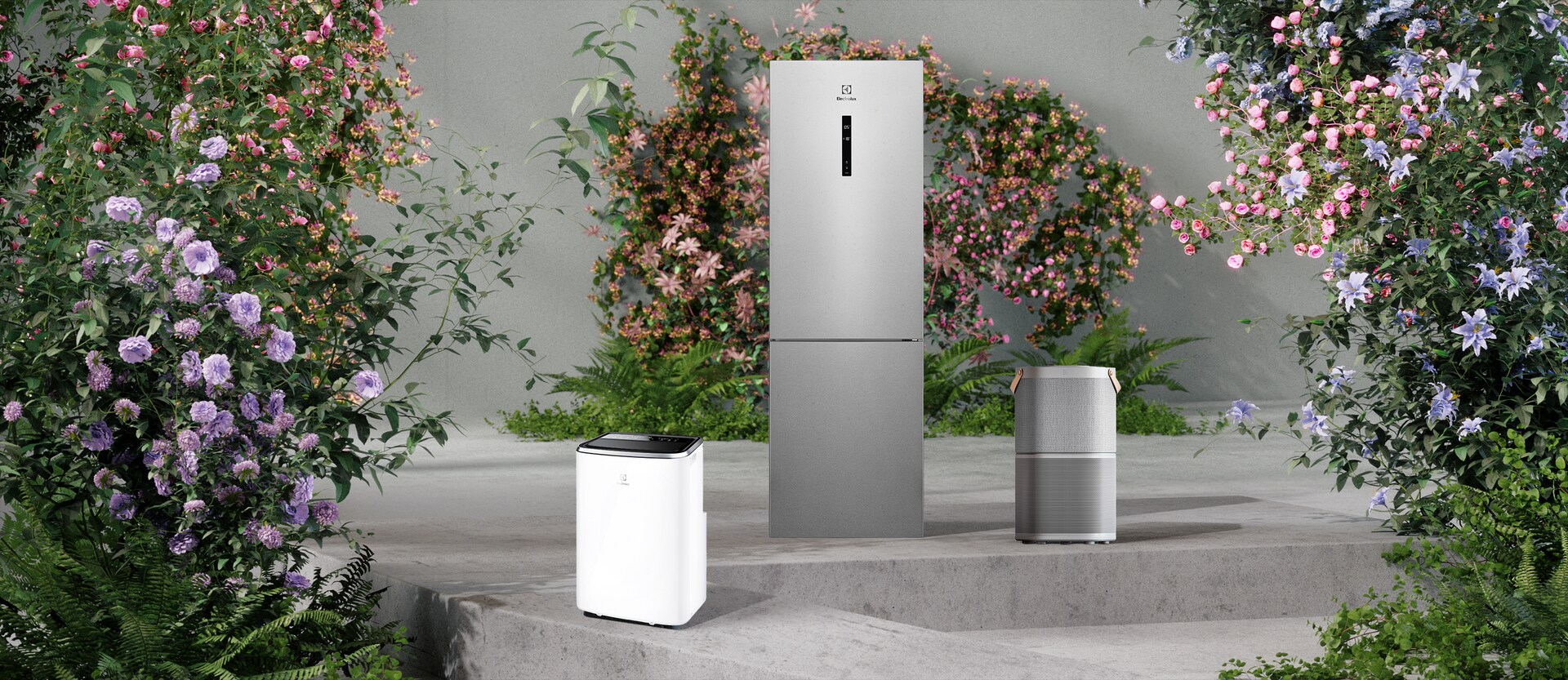 Electrolux buitiniais prietaisais, pro langą matomas pievų ir medžių fonas